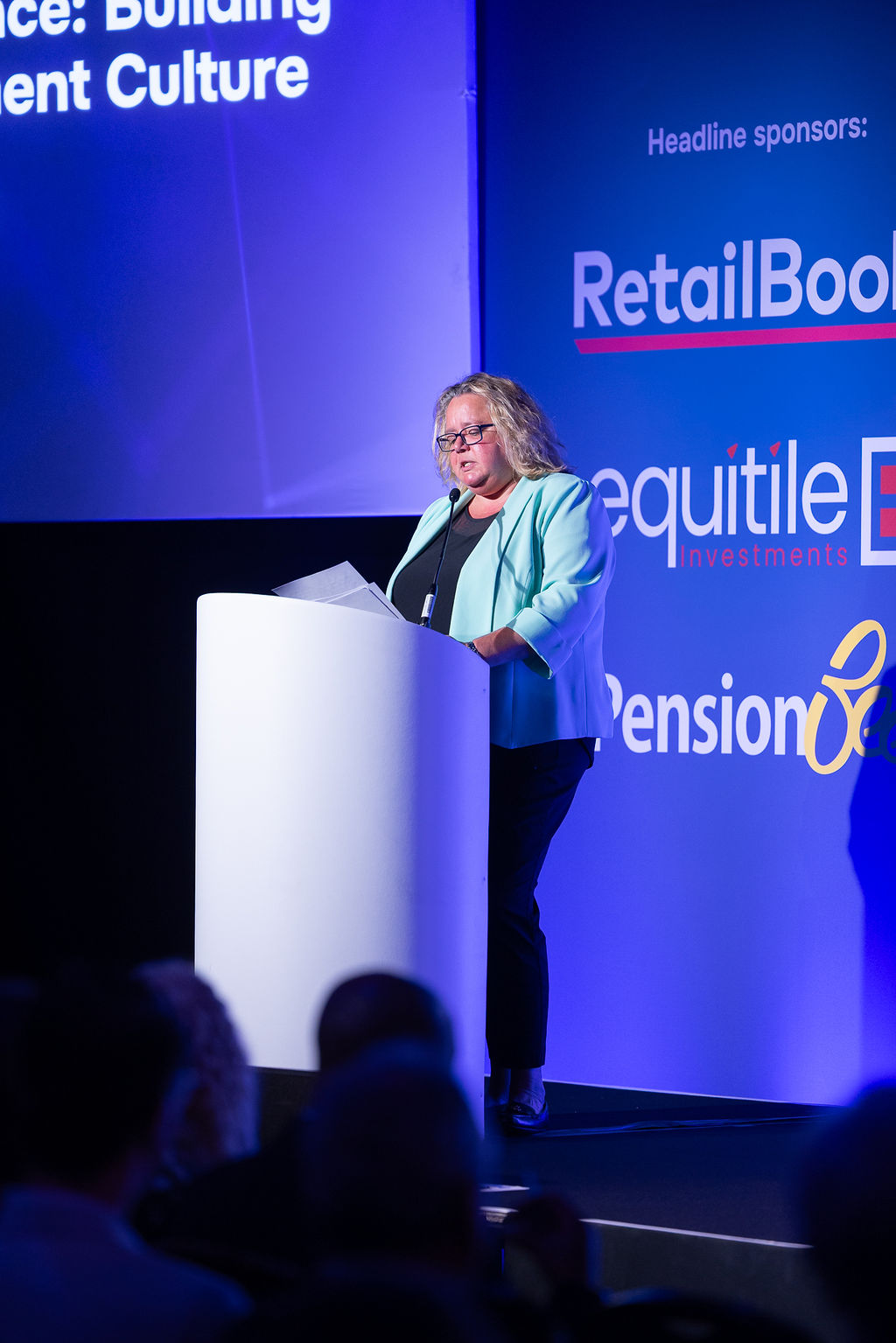 A speaker at the lectern on the main stage