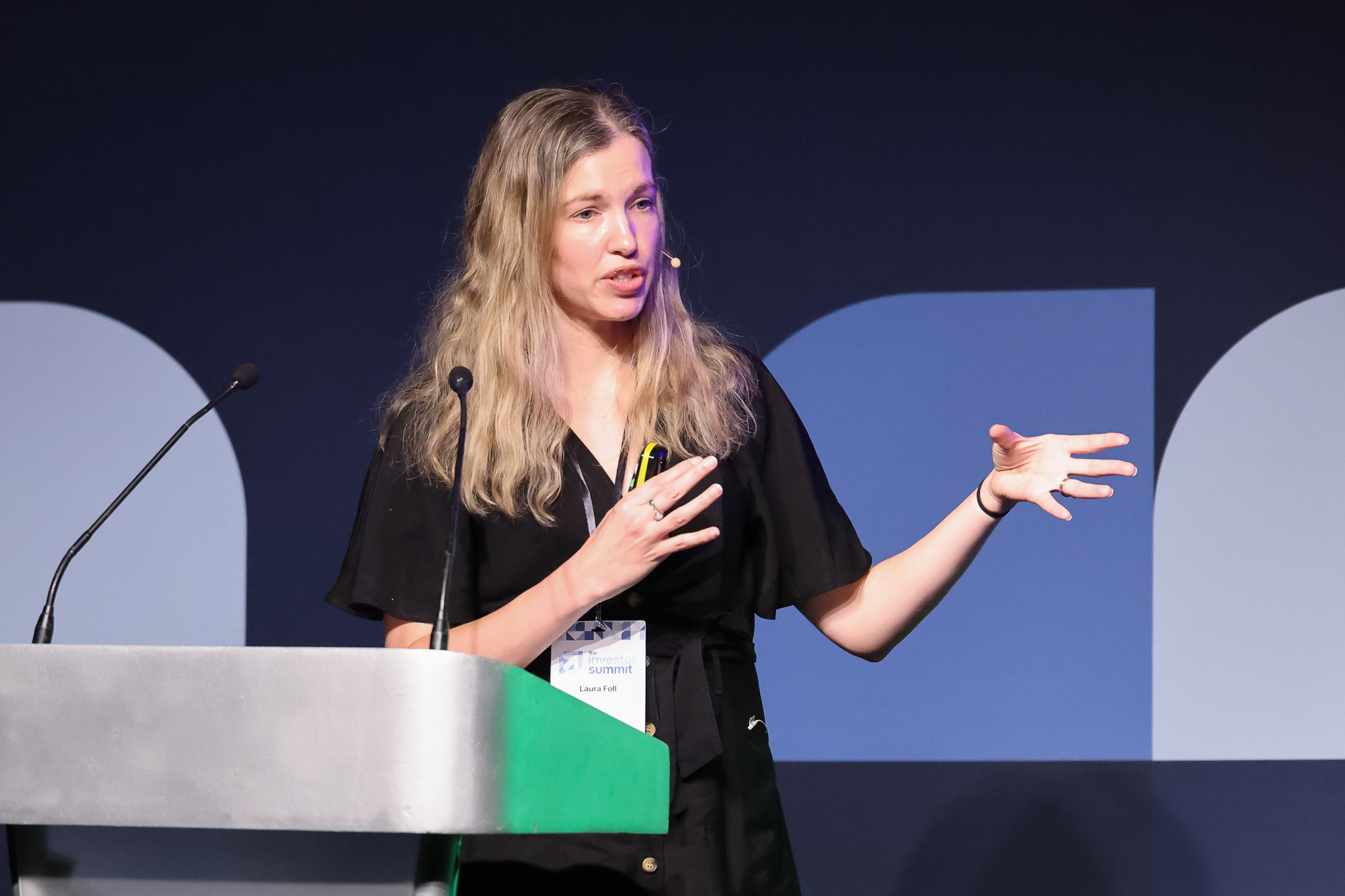 Speaker delivering a keynote at Investor Summit